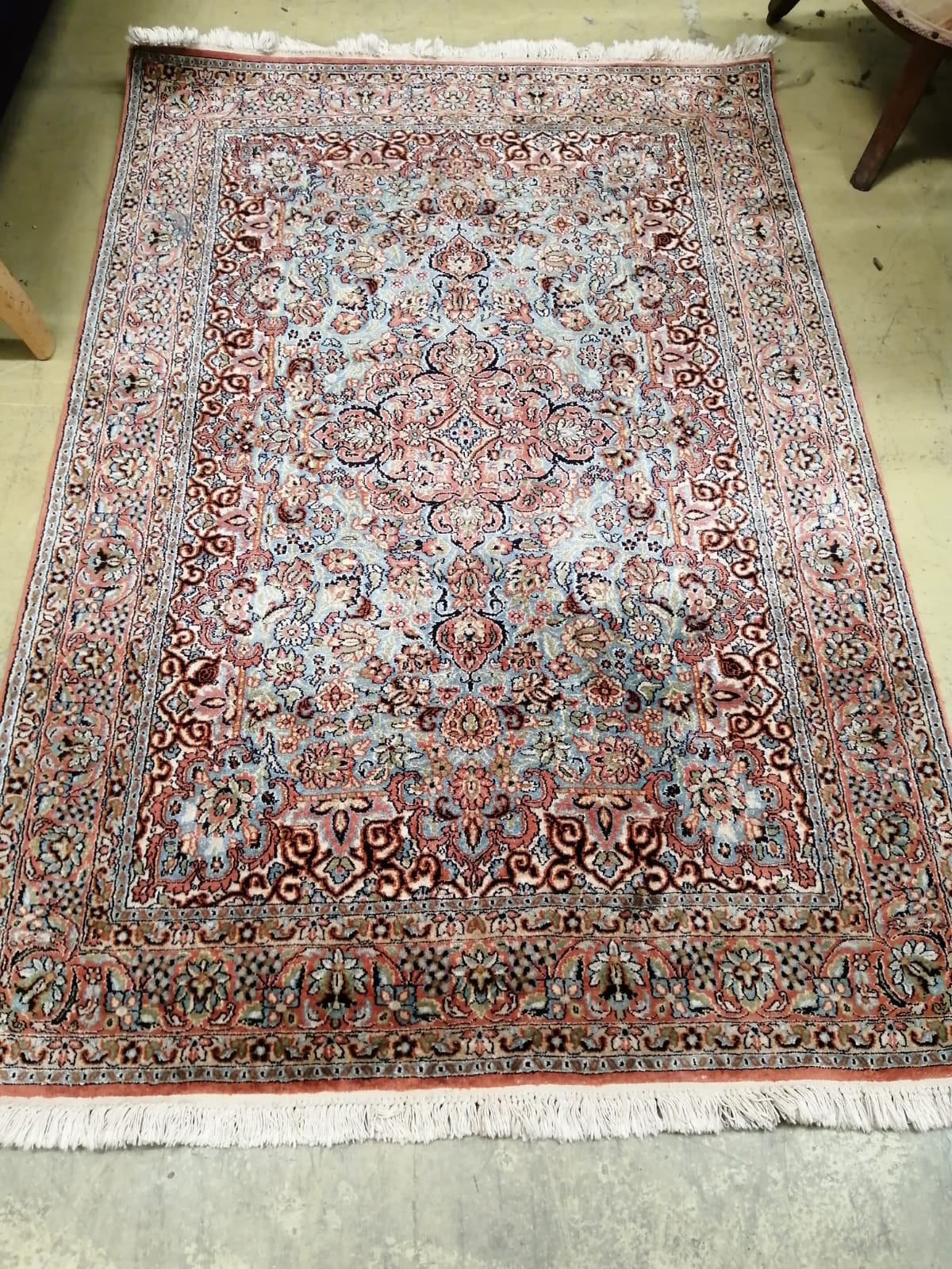 A Kashan style part silk blue ground rug, 185 x 123cm